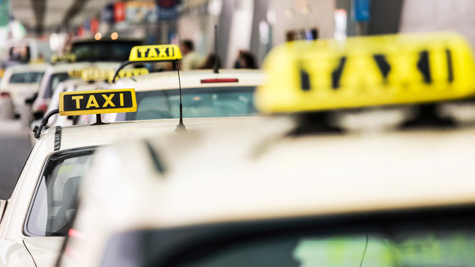 A queue of taxis waiting for passengers